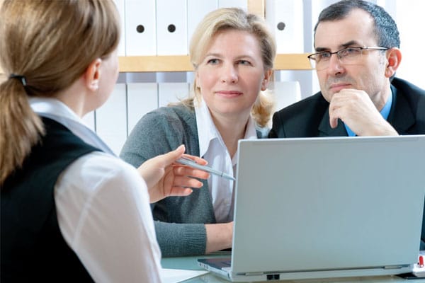 At Virtus Wealth Management and Financial Advisers, our goal is to provide you with access to quality financial advice and investment management solutions, whether that's through 401k's, insurance or annuity products or any other type of investment vehicle. Image of a female financial advisor talking with a couple about financial plans.