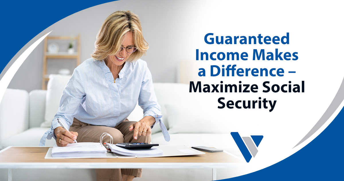Image of a senior reviewing finances and retirement paperwork at a desk, featuring Virtus Wealth Management, emphasizing how guaranteed income makes a difference and ways to maximize Social Security benefits for a secure retirement.