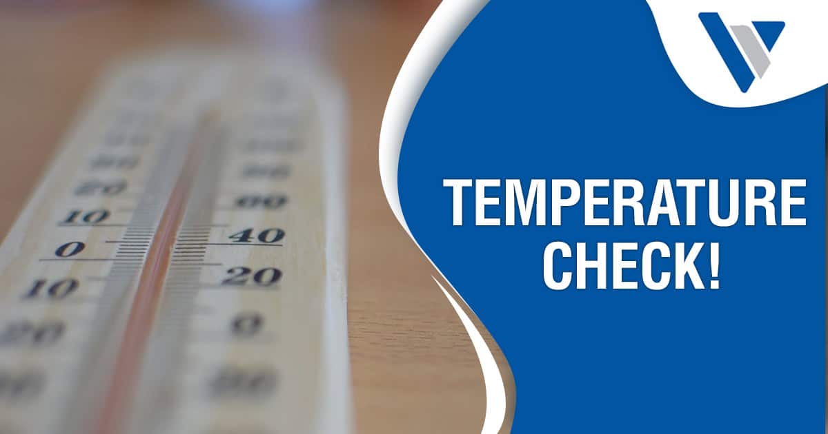 Thermometer resting on a wooden surface