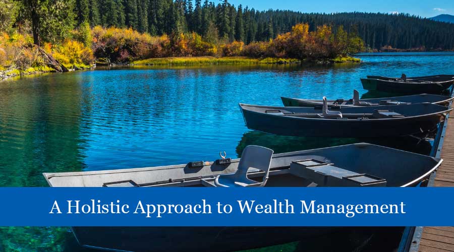 Lakeside scene with boats docked at a wooden pier, surrounded by trees and autumn foliage, with banner text “A Holistic Approach to Wealth Management.”
