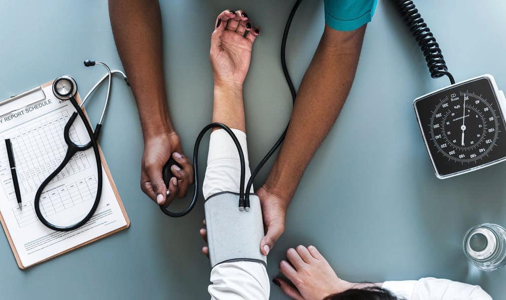 Doctor taking a patient's blood pressure